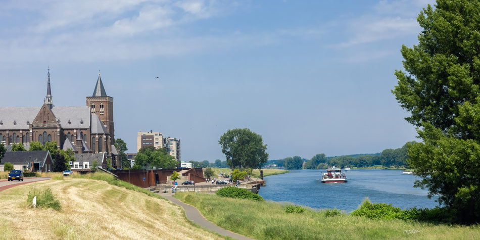 Dutch village Cuijk along river Meuse, view at Martinus church