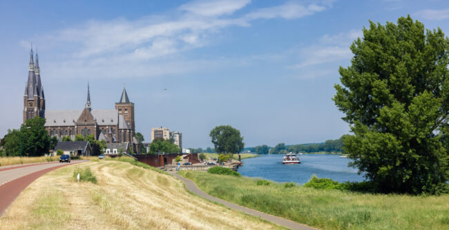 Dutch village Cuijk along river Meuse, view at Martinus church